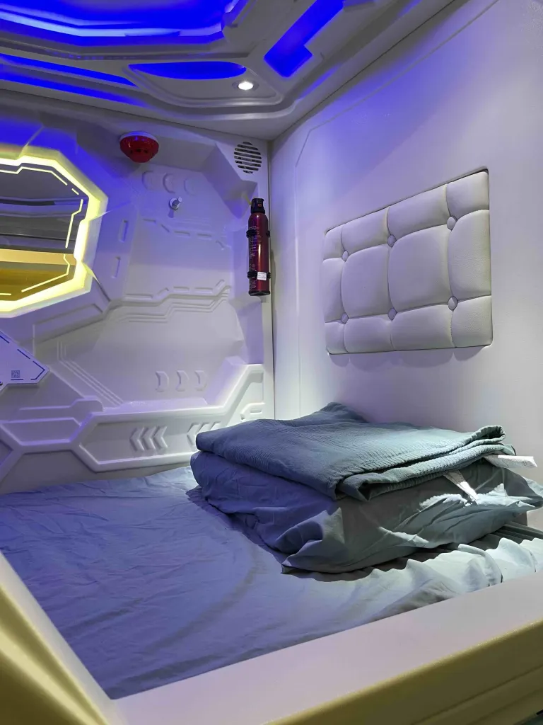 Capsule pod amenities including USB charging and ventilation