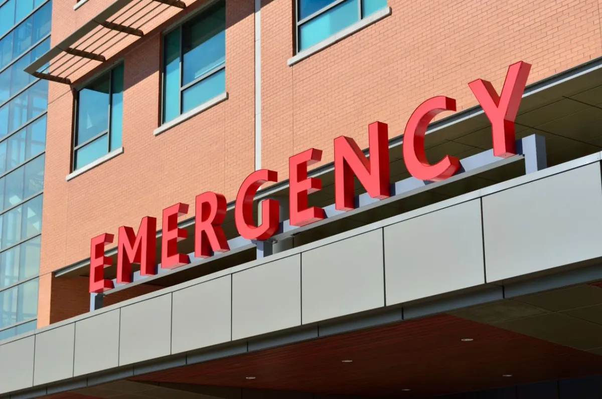 Red and white emergency department sign at a hospital entrance in Johor Bahru, Malaysia