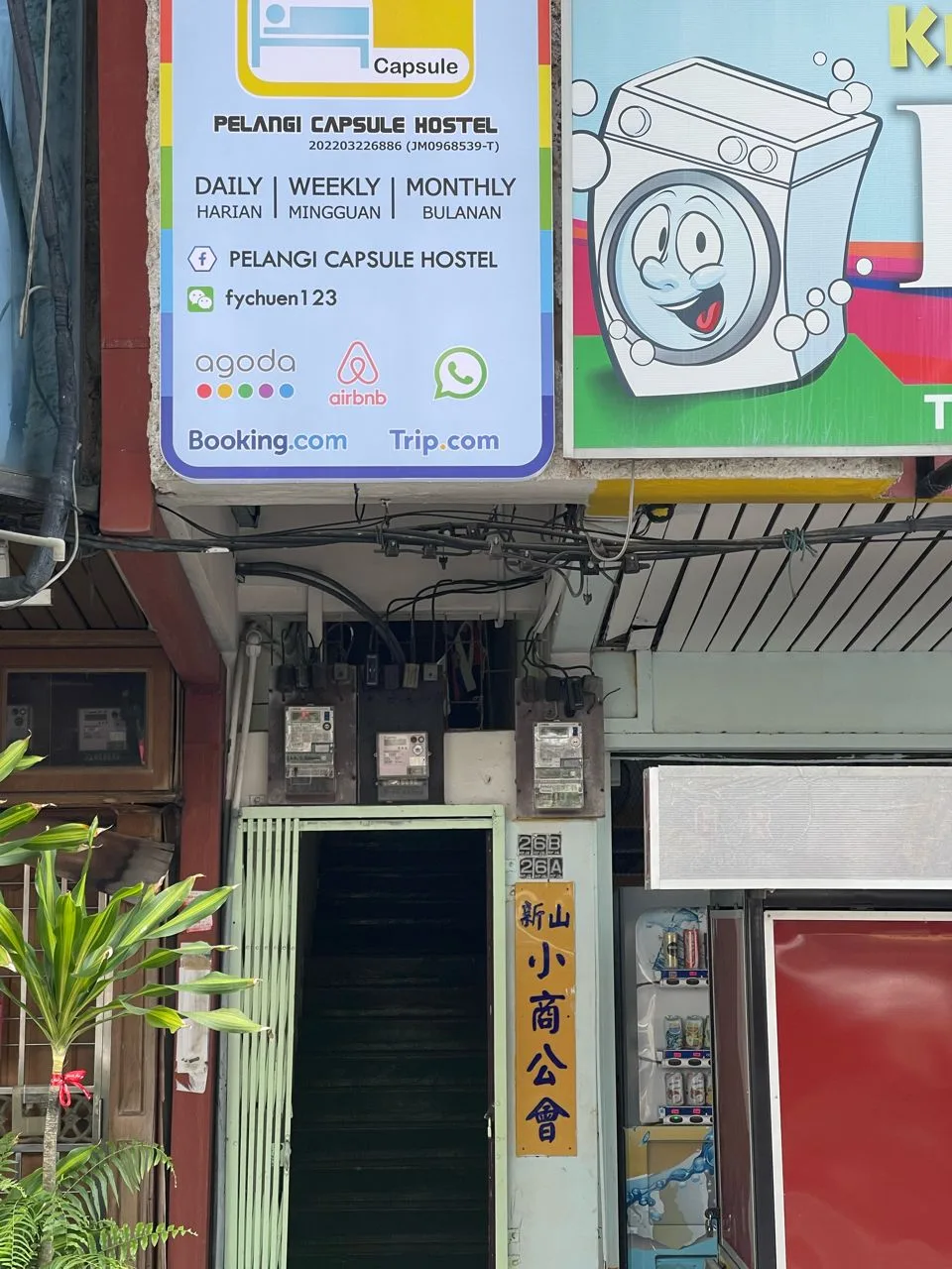 Main entrance of Pelangi Capsule Hostel with signage in Taman Pelangi JB