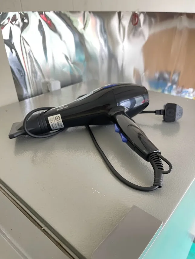 Hair dryer available for guest use at Pelangi Capsule Hostel
