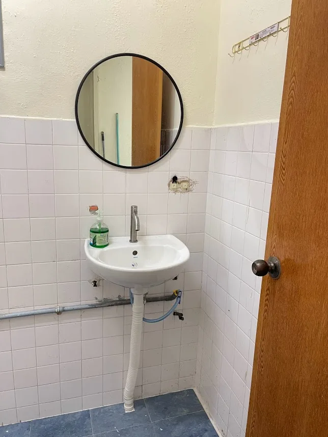Clean shared bathroom with hot shower facilities at Pelangi Capsule Hostel